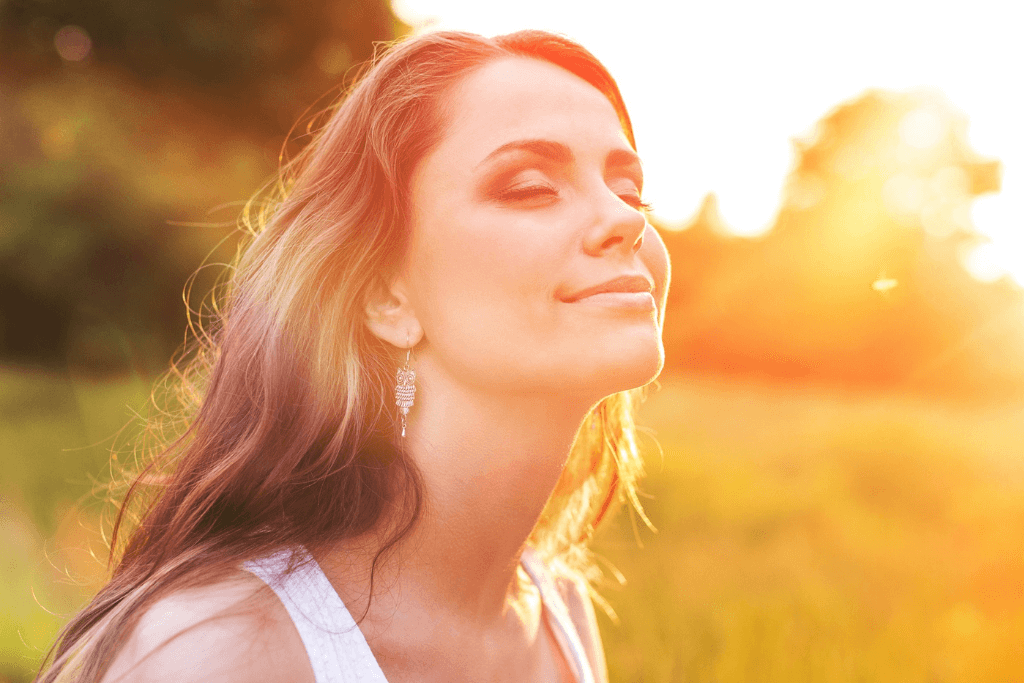 How happy are you - a lady gazing into the summer sun and measuring her happiness